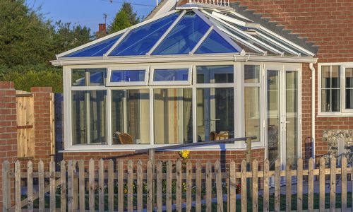 conservatory tables chairs plants room in house next to garden